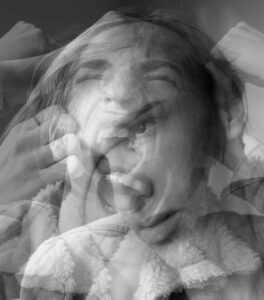 person experiencing intense emotional overwhelm and subconscious triggers
