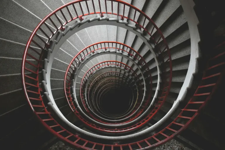 An abstract architectural spiral staircase representing the subconscious mind and a visual map of how habits form in the brain.