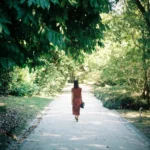 person standing alone looking lost and confused about direction in life