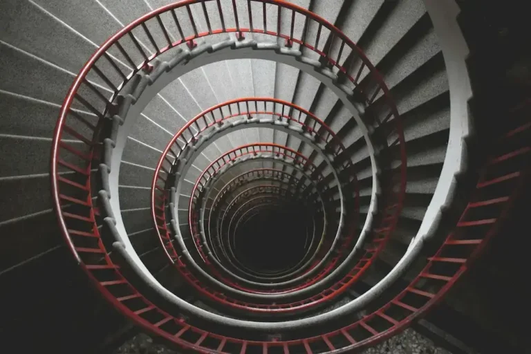 Abstract spiral staircase symbolizing how habits are formed through repeated behavioral patterns and subconscious conditioning.