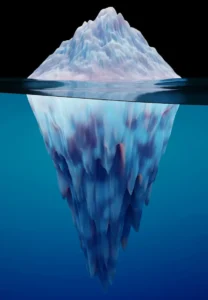 An iceberg floating in deep blue water representing the conscious and subconscious mind.