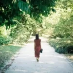 person standing alone looking lost and confused about direction in life