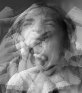person experiencing intense emotional overwhelm and subconscious triggers