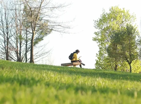 person sitting alone in nature reflecting on life and habits